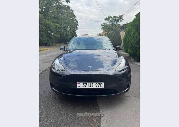Tesla Model Y 2024 — photo 1