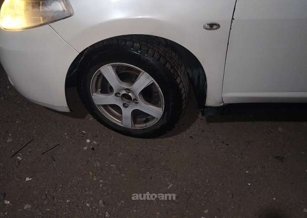 Nissan Tiida 2010 — լուսանկար 15